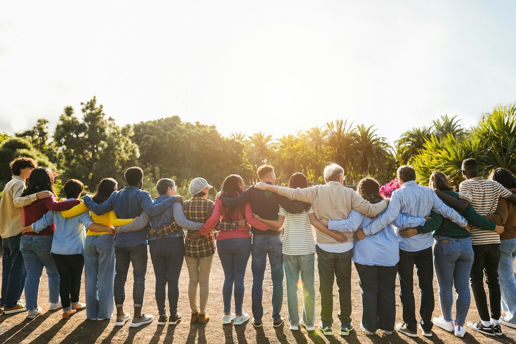 Group of multigenerational people hugging each others - Support, multiracial and diversity concept